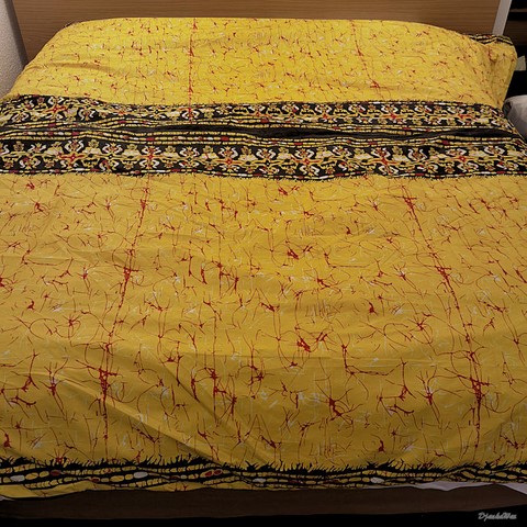 ​Reversible duvet + pillowcases in wax fabric,